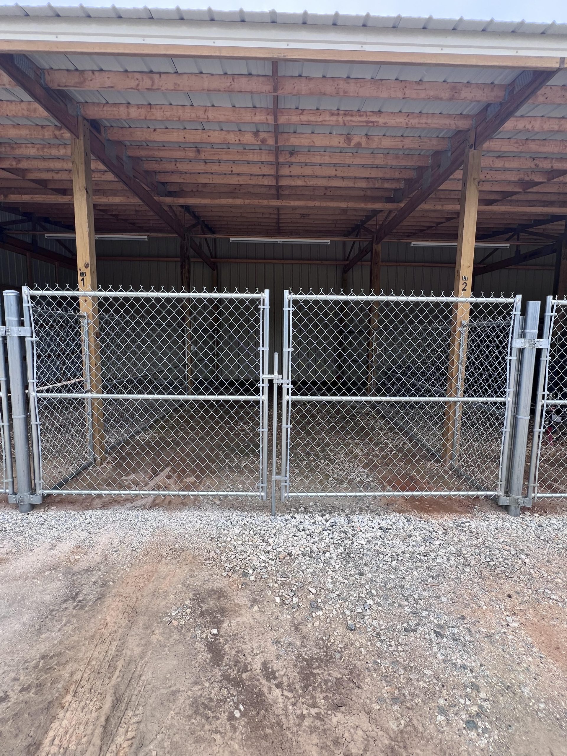 Secure gated entry to covered boat storage facility